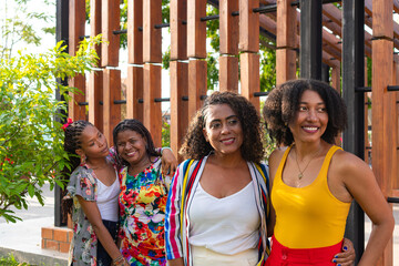 black women embracing in nature