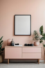 a blank black portrait frame hangs on the wall above a pastel pink wooden sideboard