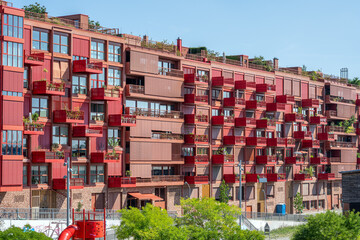 Modern red apartment building seen in Berlin, Germany
