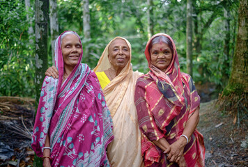 Fototapeta na wymiar Portrait of south asian elderly women, Hindu old friends are in traditional colourful clothes 