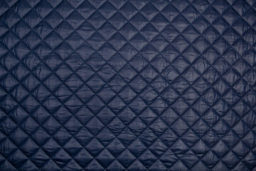 Fabric velour quilted close-up. Quilted surface upholstery