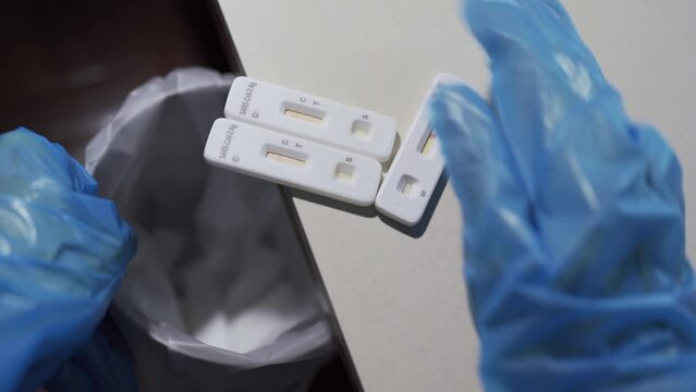 Medical staff disposing used Covid-19 antigen test kits