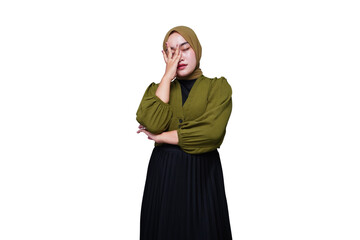 Asian hijab woman holding her head with dizzy expression
