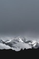 Vertical mountain landscape with gray sky
