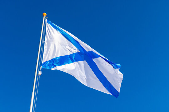 Ensign of the Russian Navy is under blue sky