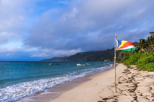Coastal landscape with the flag of Seychelles