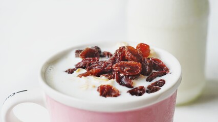 Oatmeal, raisins, fresh milk. Health drinks, breakfast.
