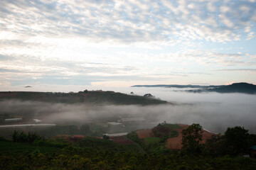 Dawn on the outskirts of Da Lat, a morning with dew covering the hilltops, in the sky there are beautiful colorful fish scale clouds.