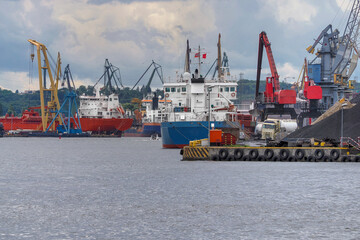 Naklejka premium Ships gathered in the Port of Gdansk during unloading and loading. Port of Gdansk, Poland