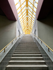 Symmetrical picture with staircase under transparent glass roof. Architecture - obrazy, fototapety, plakaty