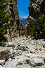 A dry, rocky river bed at the bottom of a deep gorge in the middle of a dry, hot summer (Samaria...