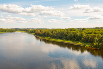 The splendor of our planet! Beautiful summer landscape, river forest sky clouds Top view.Latvia.