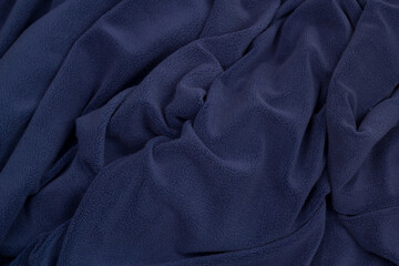 Obraz premium Fleece fabric blue top view. Texture of textile fleece bedspread. 