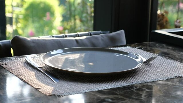  fork, knife and a circle shape plate on table 