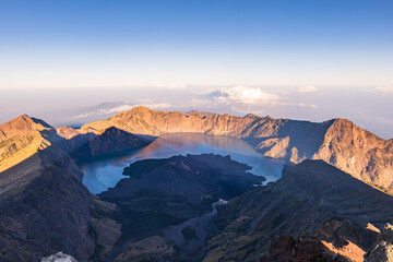 Mount Rinjani crater and lake view from summit at sunrise, Lombok, Indonesia. Rinjani is the second highest active volcano in Indonesia