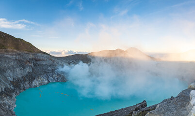 Mount Ijen, a volcano and sulphur mine located near Banyuwangi in East Java, Indonesia. Panoramic image of Ijen crater, a famous touristic destination for tourists in Java island, Indonesia. 