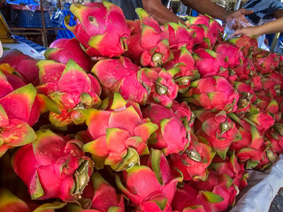 Pile of Dragon fruit in a local market in Thailand, Organic Dragon fruit in supermarket. Fresh...