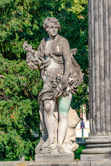 Obraz premium Potsdam, Germany - Old statue of a sensual Renaissance era woman after bathing in the city park and gardens of Potsdam, details, closeup.