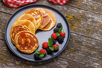 Tasty homemade pancakes with berries