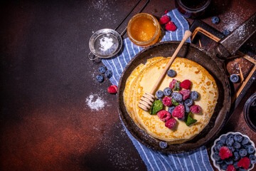 Crepes pancakes with berry