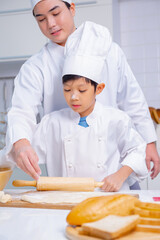 father and son cooking