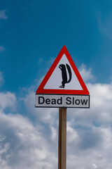 Dead slow sign caution to squirrels - 641169702
