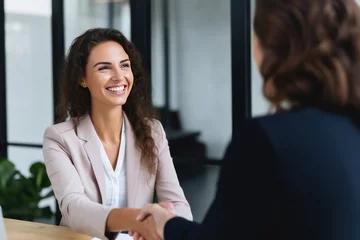 Stickers pour porte Vielles portes Happy mid aged business woman manager handshaking at office meeting. Smiling female HR hiring recruit at job interview, bank or insurance agent, lawyer making contract deal with client at work.