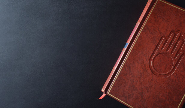 Background With Sacred Book With Engraved Jain Symbol Top View