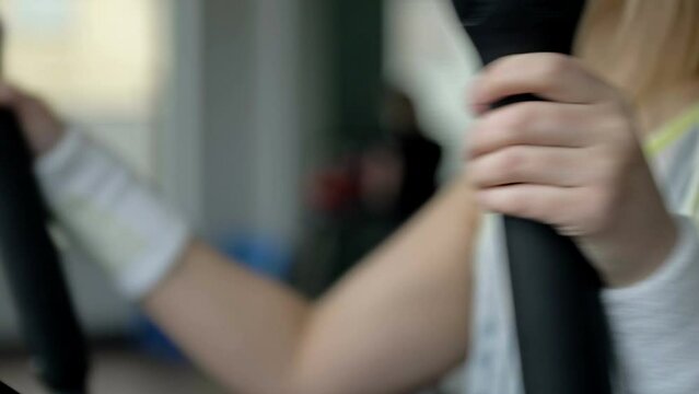 Woman's hand sets the parameters on the display of the simulator.