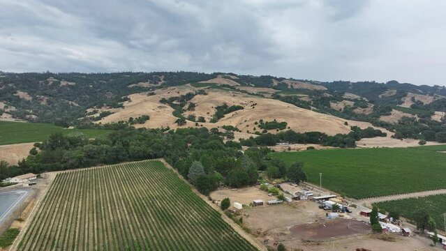 Aerial California Boonville vineyard valley farms hills 4. Mendocino county, California. Grape, wine farm regions along Navarro River. Mountains, hills, valley and farming. Redwood and pine forests.