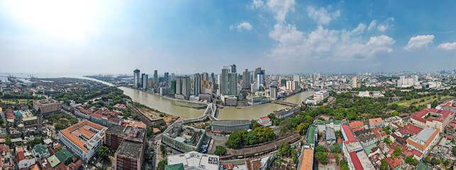 Manila, Philippines - Panoramic shot of the Binondo skyline and the Pasig river traversed by the...
