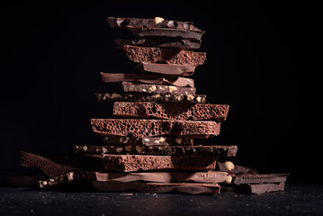 Various chocolate pieces on dark background