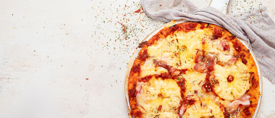 Pizza hawaii with ham and pineapple.