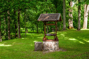 Old well water pump in garden. Stende Manor, Latvia.