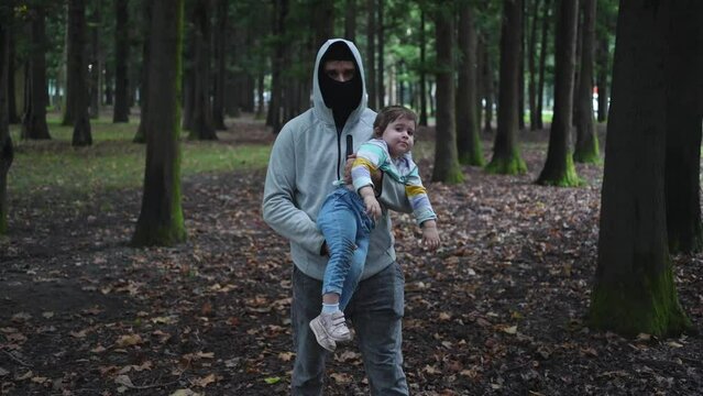 kidnapping problem, a child in the hands of a masked bandit