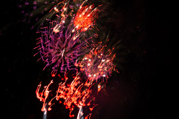 Abstract photo of firework flower. Salute without focus. The official celebration with fireworks on the Venta embankment.