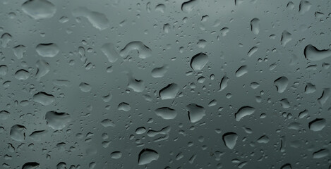 Lots of rain droplets on transparent glass, Water droplets outside in the rainy season