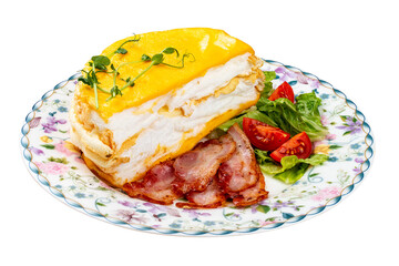 Omelette layered with fried bacon and fresh vegetables. Breakfast.