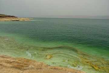 Welcome to the Dead Sea and its historic sites, a salt lake shared between Israel, the West Bank and Jordan. 09 June 2023 on a hot sunny day. Officially the lowest point on earth 430 metres, 1412 ft. 