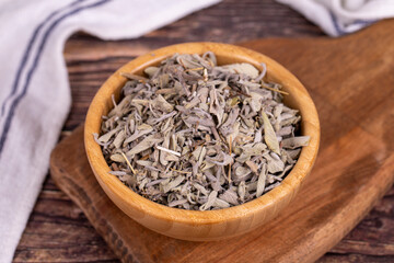Dry Sage leaves. Dried salvia or sage leaves in wood bowl. herbal medicine. Close up