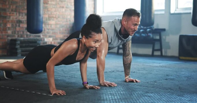 Happy man, woman and push up for gym workout, training and team exercise on floor in health club. Diversity, strong friends and bodybuilding challenge with fitness partner for action, muscle or power