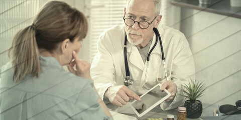 Obraz premium Doctor showing reports on digital tablet to his female patient, geometric pattern