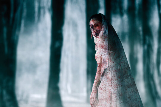 zombie in white dress black long hair ghost zombie with a forest background