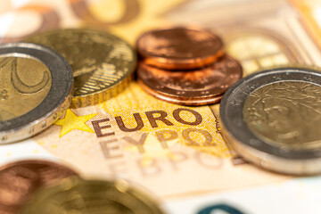 Euro money, paper banknotes and coins close-up macro