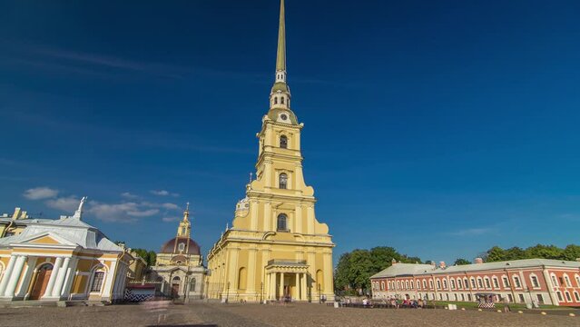 Citadel's Charm: Peter and Paul Fortress Timelapse Hyperlapse. Petropavlovskaya Krepost, Iconic Landmark in St. Petersburg, Russia. Front View of Facade Against a Blue Cloudy Sky