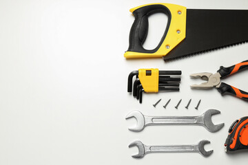 Construction tools on white background, space for text