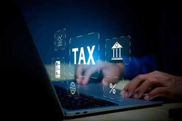 income tax concept. Businessman using laptop analyzing data to online income tax form. tax system icon around. pay online income tax. futuristic virtual screen interface technology..