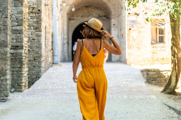 A woman walking in the arches of the fortress of the Ottoman castle of Gjirokaster or Gjirokastra. Albanian