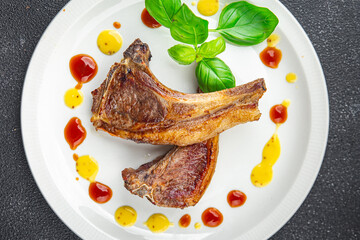 lamb cutlet on the bone fresh meat portion food ready to eat healthy appetizer meal food snack on the table