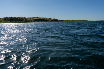 blue water body in a lake with a small waves in